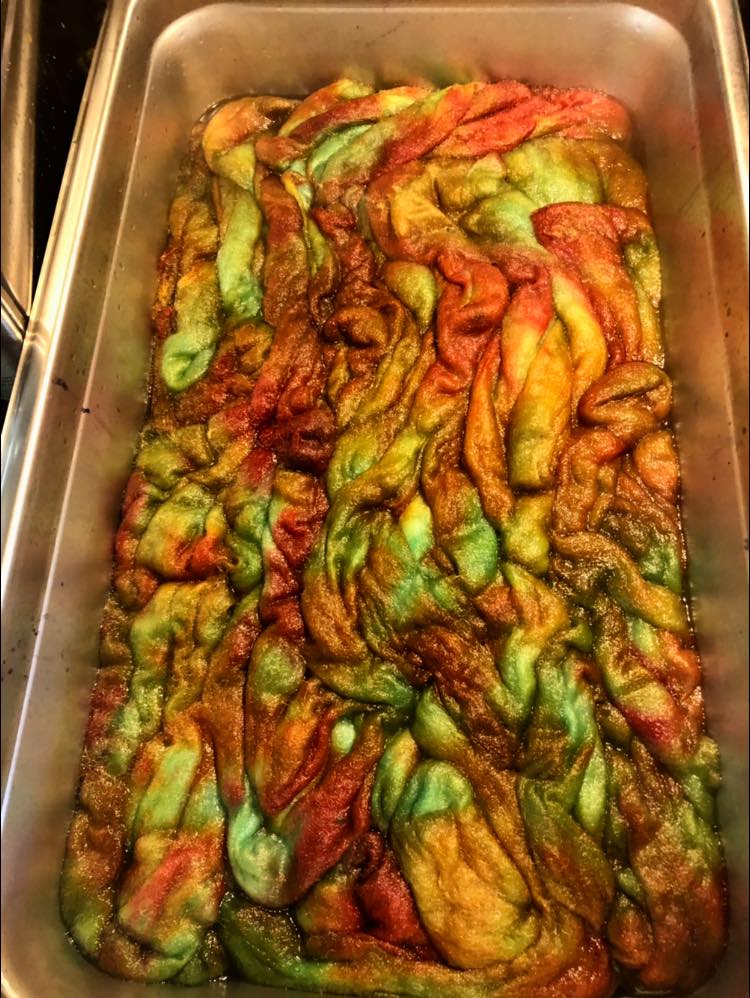 Roving in the pan dyed with fall colours - orange, green, yellow